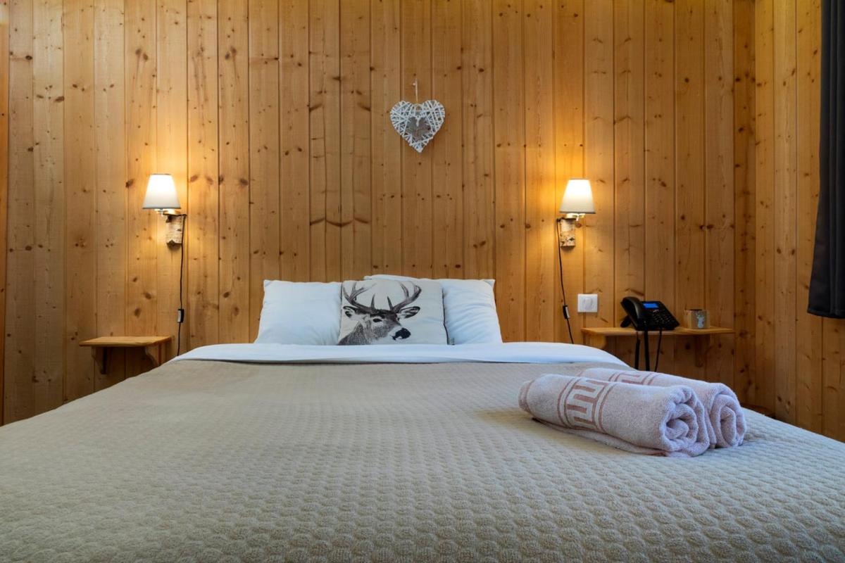 Un ou plusieurs lits dans un hébergement de l'établissement Domaine du Hirtz, Restaurant & Spa