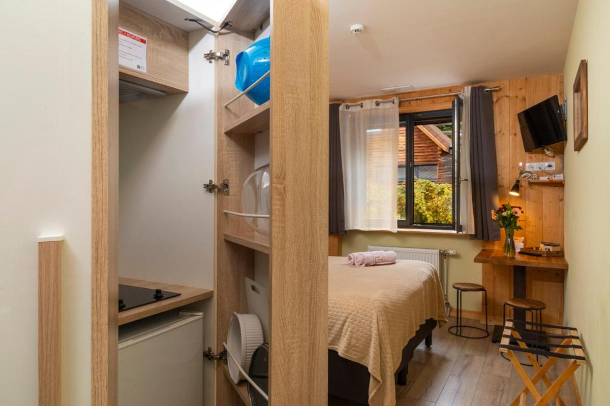 Un ou plusieurs lits dans un hébergement de l'établissement Domaine du Hirtz, Restaurant & Spa