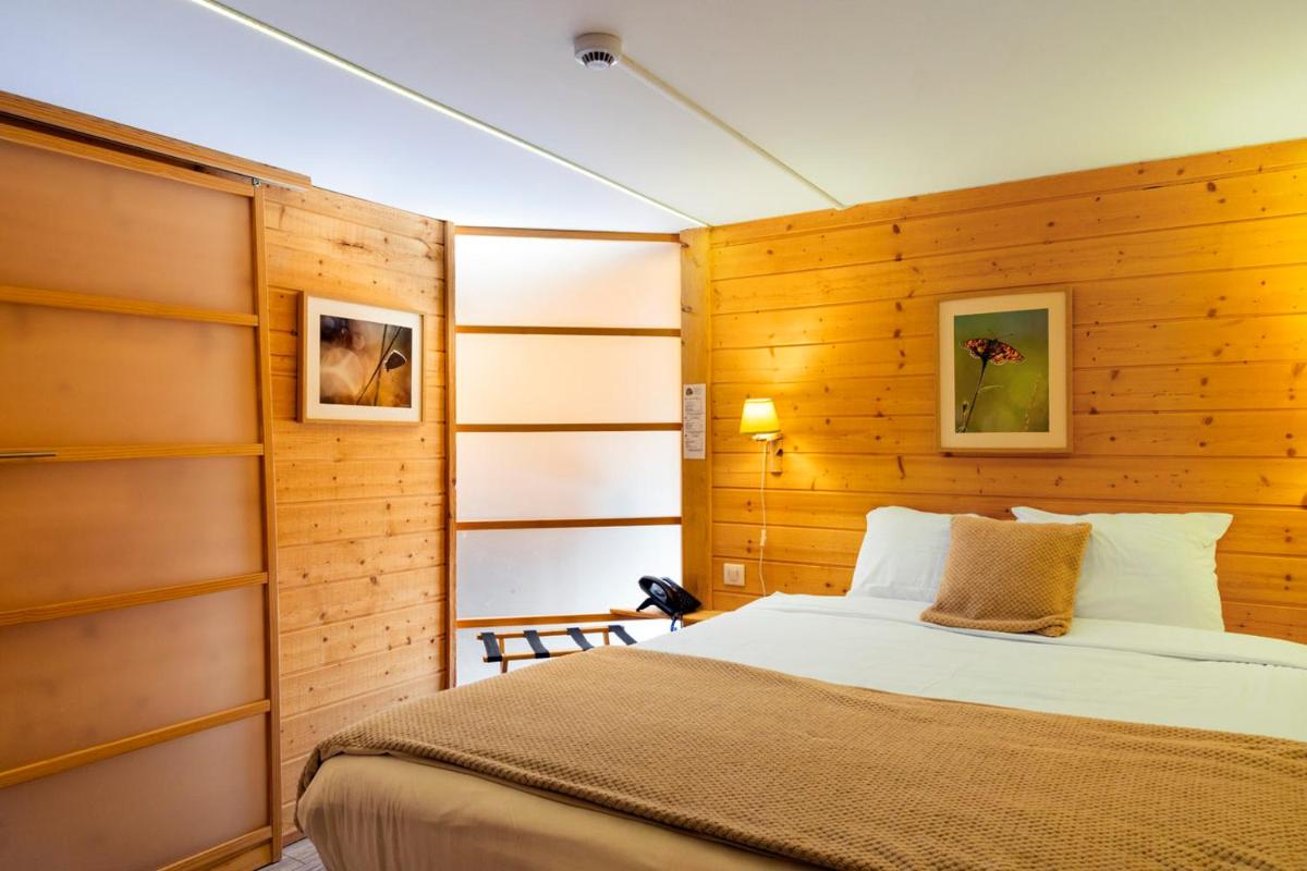 Un ou plusieurs lits dans un hébergement de l'établissement Domaine du Hirtz, Restaurant & Spa