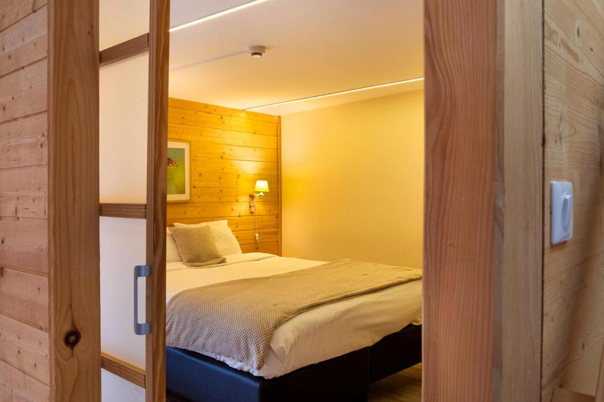 Un ou plusieurs lits dans un hébergement de l'établissement Domaine du Hirtz, Restaurant & Spa