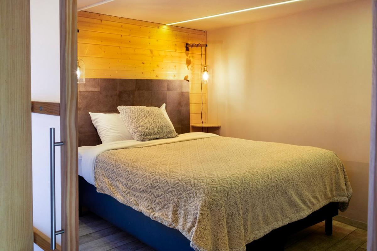 Un ou plusieurs lits dans un hébergement de l'établissement Domaine du Hirtz, Restaurant & Spa