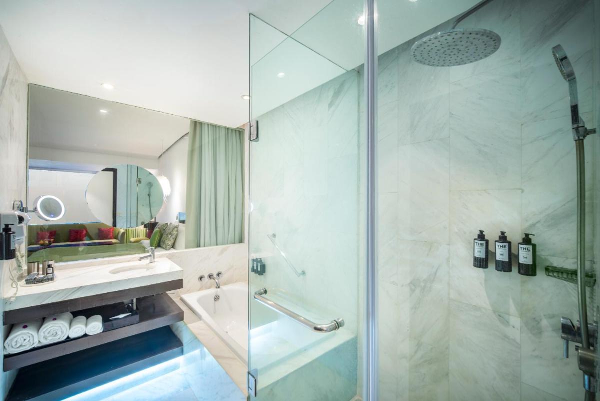 a bathroom with a shower and a sink at The Park Chennai in Chennai