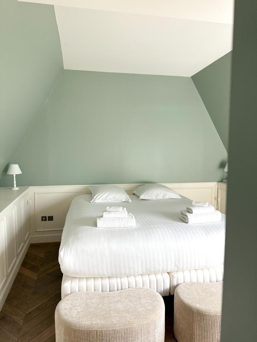 Un ou plusieurs lits dans un hébergement de l'établissement Le Grand Hôtel Le Touquet-Paris-Plage