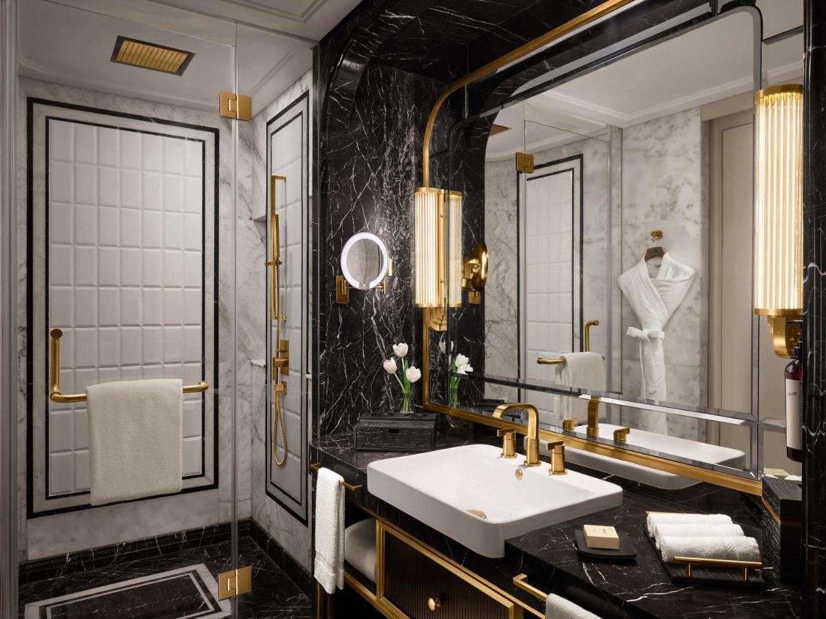 a bathroom with a sink and a mirror at Fairmont Mumbai in Mumbai