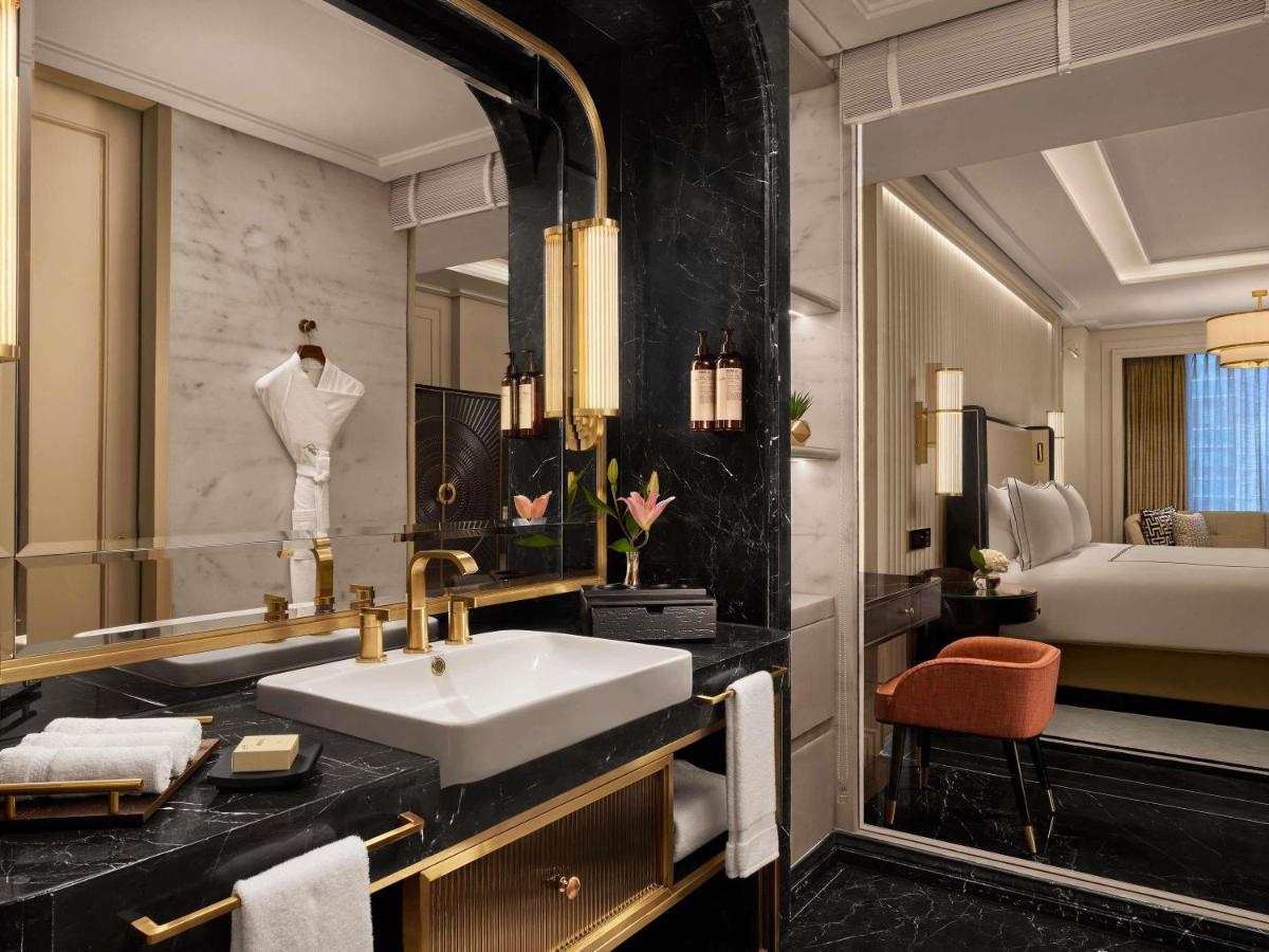a bathroom with a sink and a mirror at Fairmont Mumbai in Mumbai