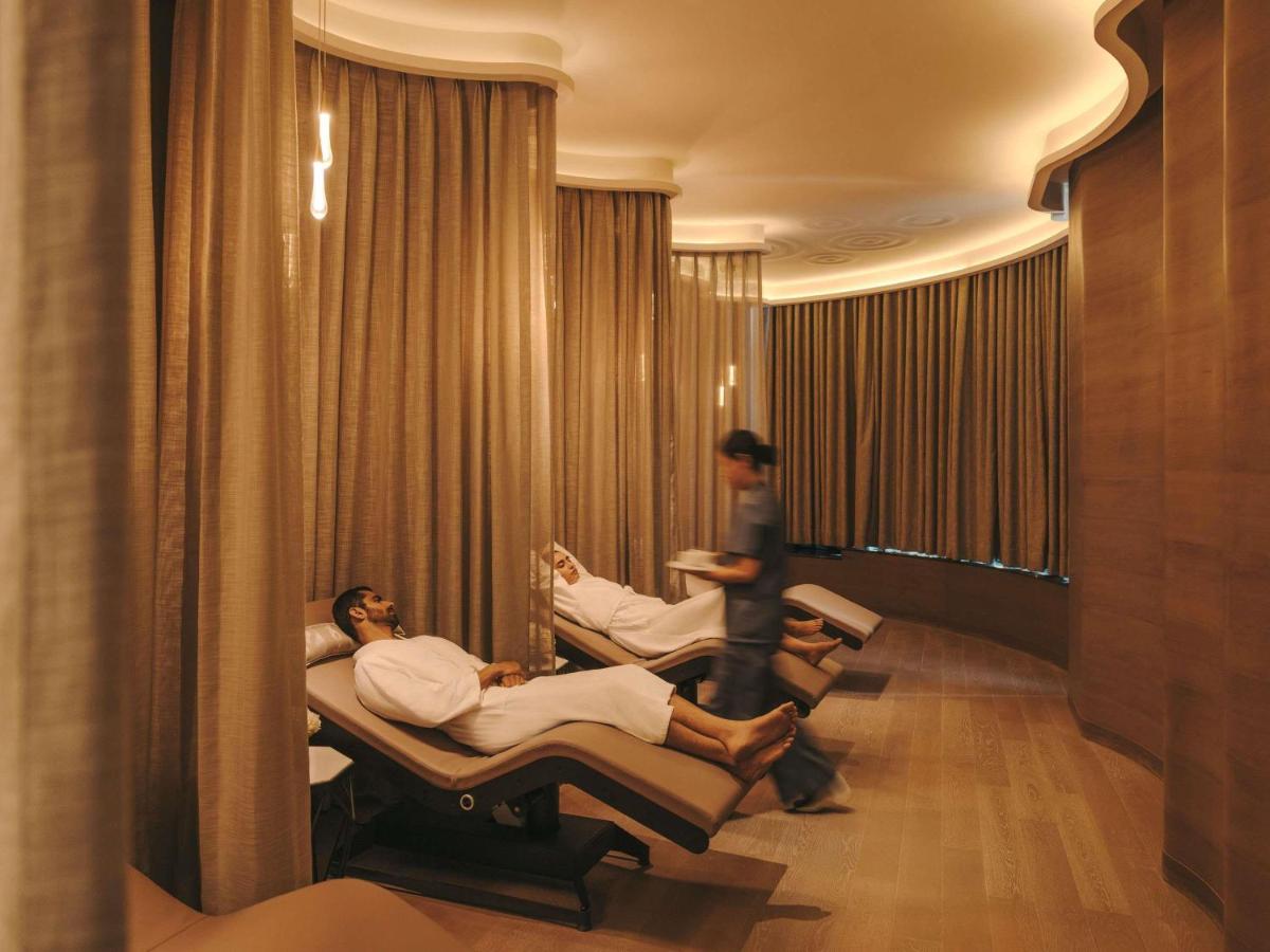 two people sitting in beds in a hospital room at Fairmont Mumbai in Mumbai