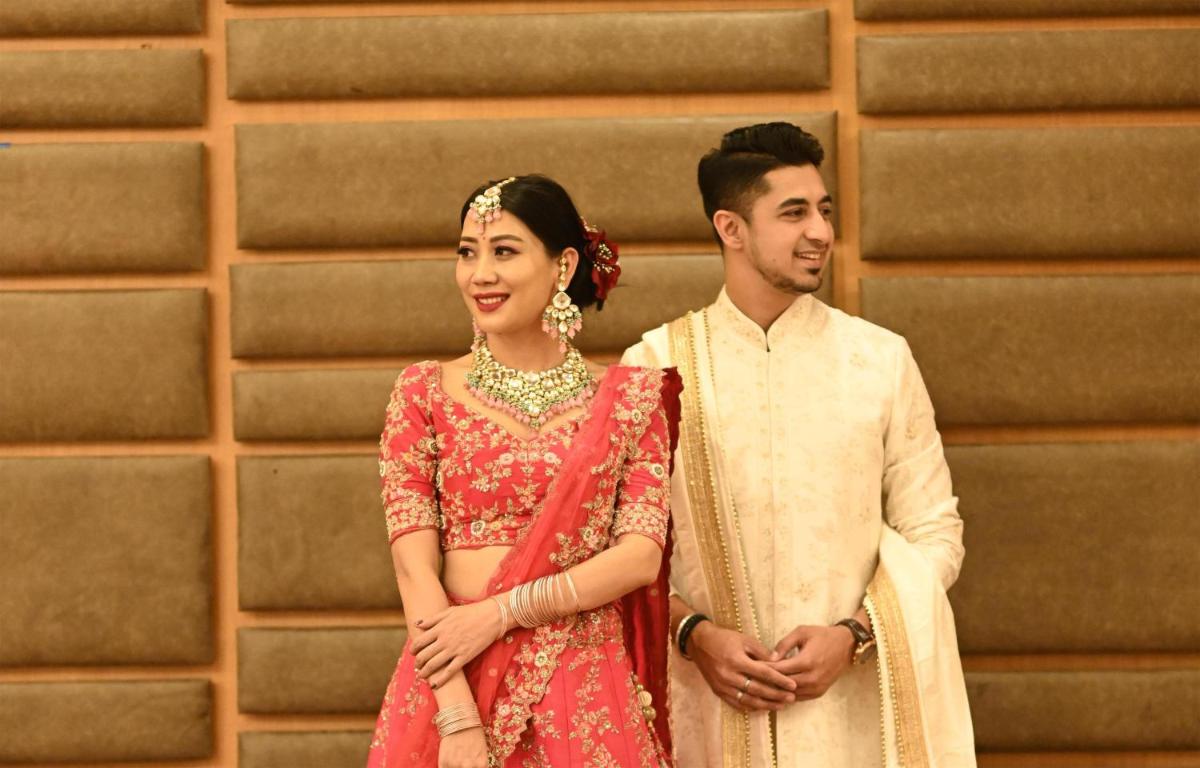 a man and a woman standing next to each other at Radisson Blu Hotel Pune Kharadi in Pune