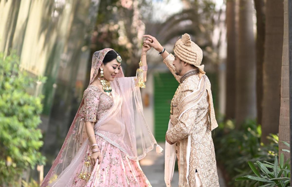 a bride and groom getting ready for their wedding ceremony at Radisson Blu Hotel Pune Kharadi in Pune