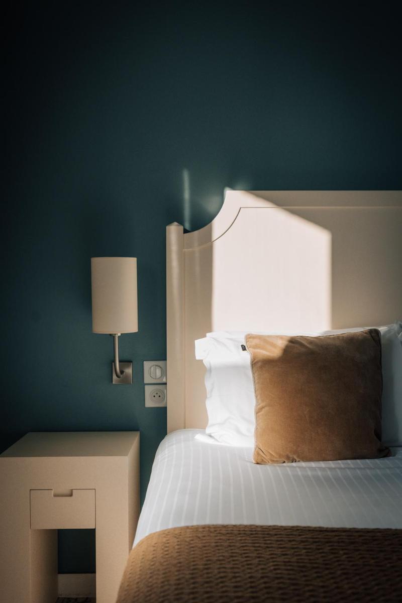 Un ou plusieurs lits dans un hébergement de l'établissement Best Western Plus Le Roi Arthur Hôtel & Spa
