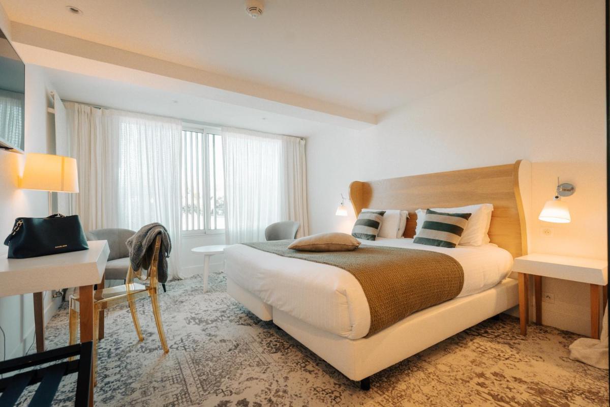 Un ou plusieurs lits dans un hébergement de l'établissement Best Western Plus Le Roi Arthur Hôtel & Spa