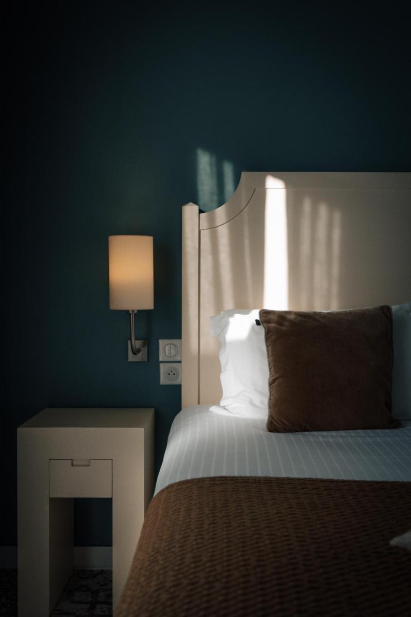 Un ou plusieurs lits dans un hébergement de l'établissement Best Western Plus Le Roi Arthur Hôtel & Spa