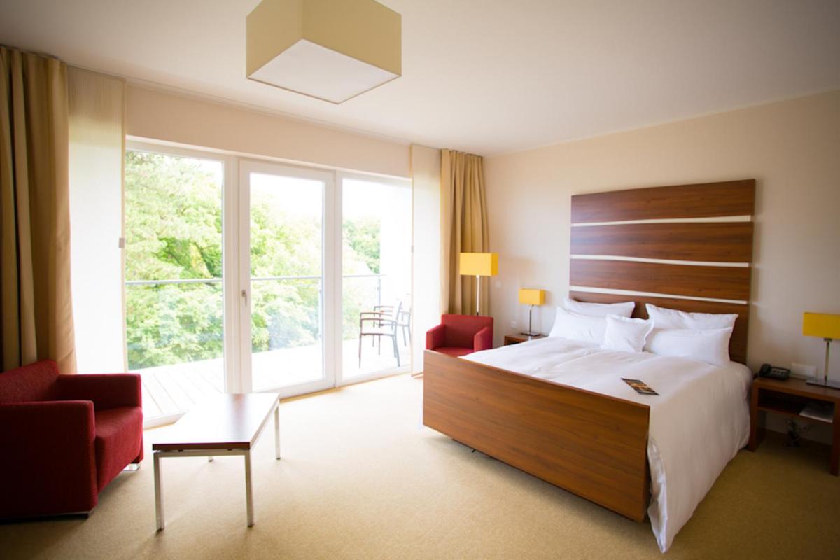 Ein Bett oder Betten in einem Zimmer der Unterkunft THE GRAND Ahrenshoop