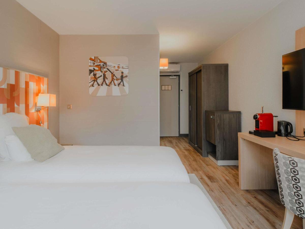 Un ou plusieurs lits dans un hébergement de l'établissement Mercure Annecy Sud