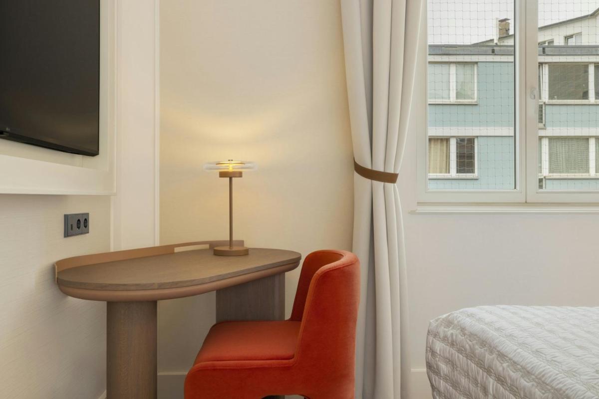 Ein Bett oder Betten in einem Zimmer der Unterkunft Le Méridien Frankfurt