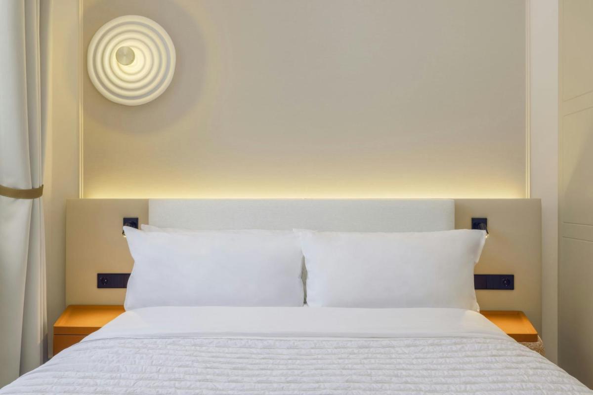 Ein Bett oder Betten in einem Zimmer der Unterkunft Le Méridien Frankfurt