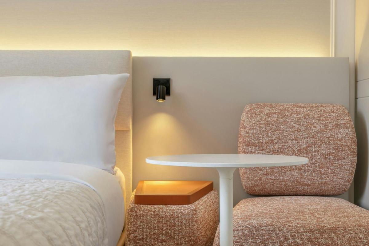 Ein Bett oder Betten in einem Zimmer der Unterkunft Le Méridien Frankfurt