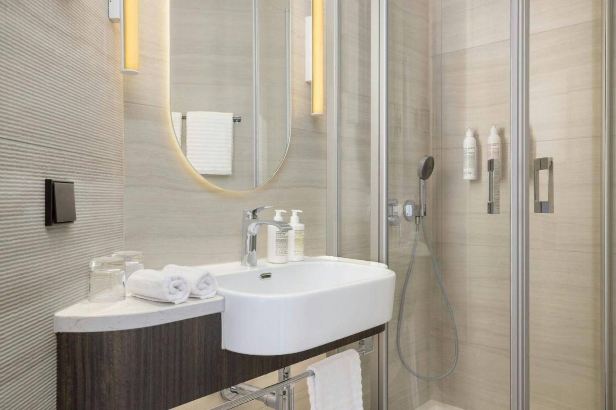 Ein Badezimmer in der Unterkunft Le Méridien Frankfurt