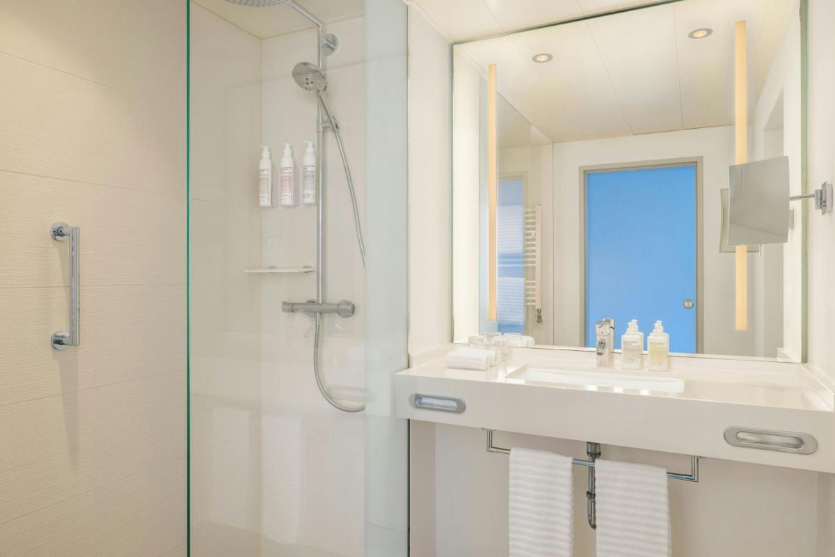 Ein Badezimmer in der Unterkunft Le Méridien Frankfurt