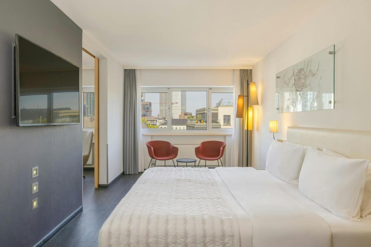 Ein Bett oder Betten in einem Zimmer der Unterkunft Le Méridien Frankfurt