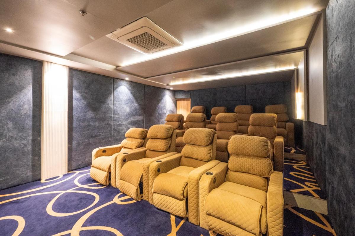 a cinema room with a bunch of chairs in it at Essentia Luxury Resort & Spa Udaipur in Udaipur