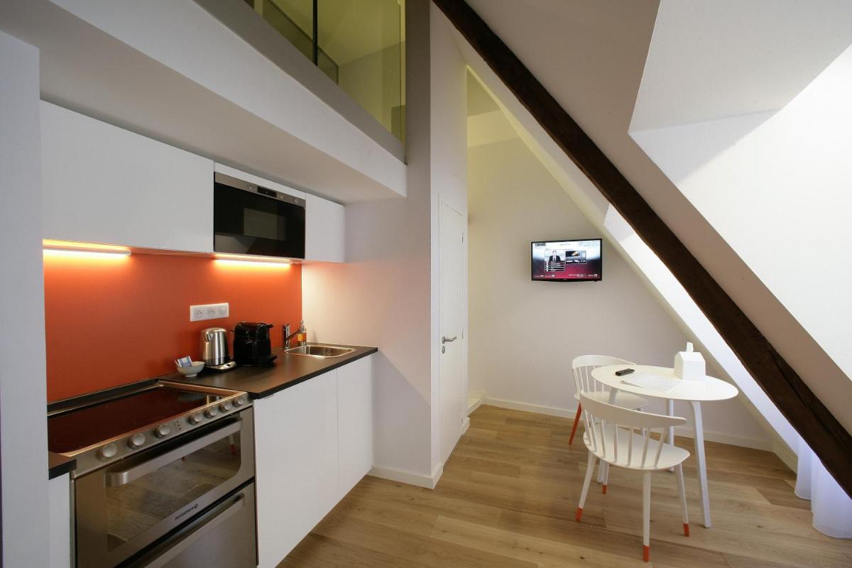 Cuisine ou kitchenette dans l'établissement Les Maisons du Pont - Charme & Caractère