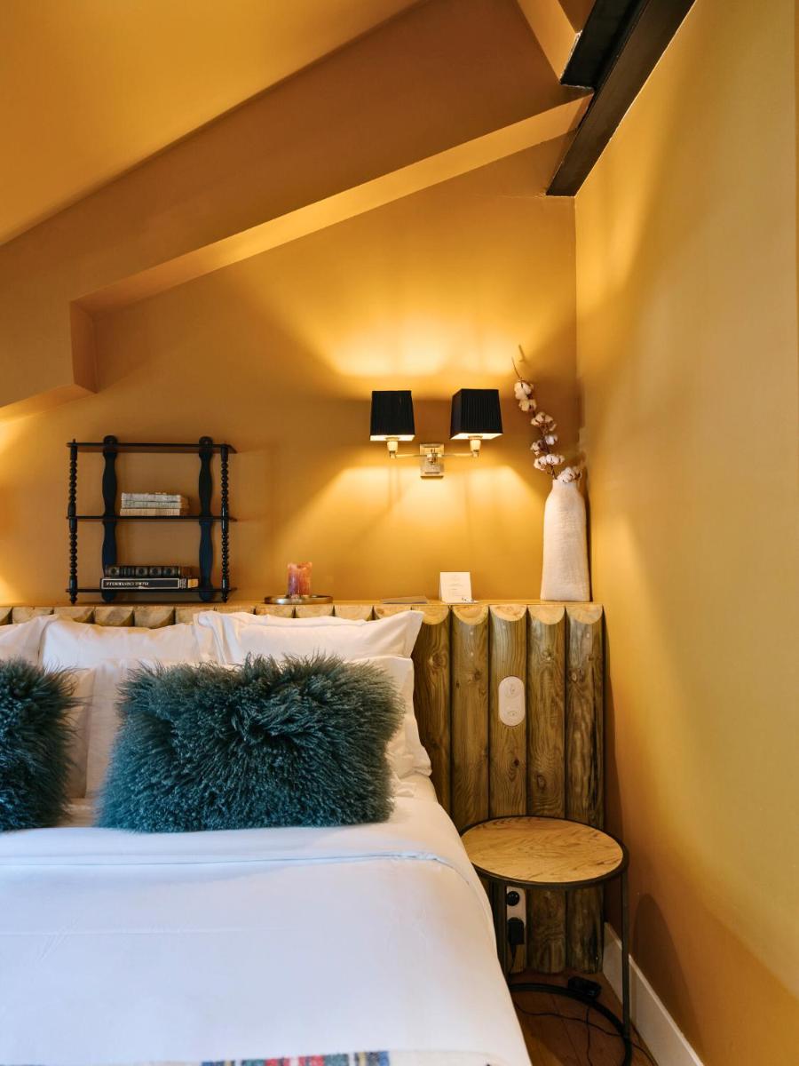 Un ou plusieurs lits dans un hébergement de l'établissement Grand Hotel Soleil d'Or