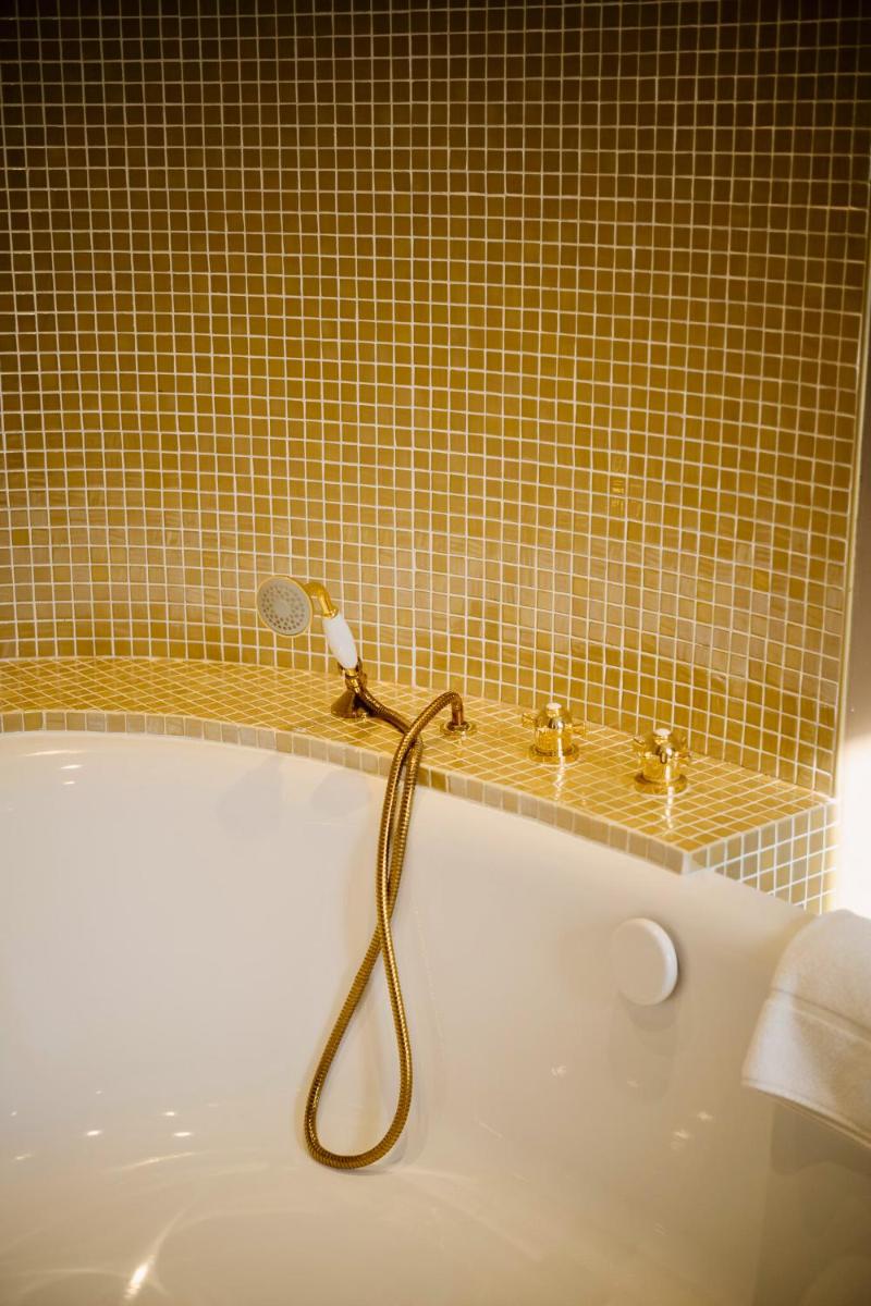 Salle de bains dans l'établissement Grand Hotel Soleil d'Or