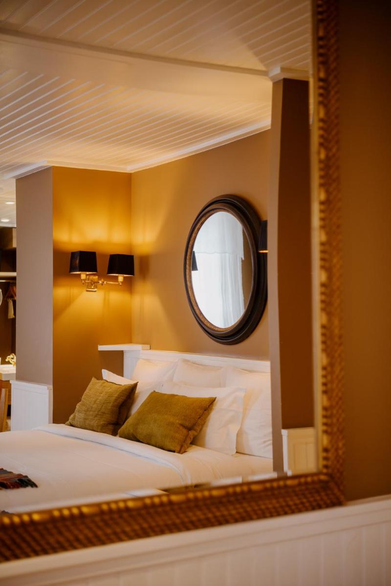 Un ou plusieurs lits dans un hébergement de l'établissement Grand Hotel Soleil d'Or