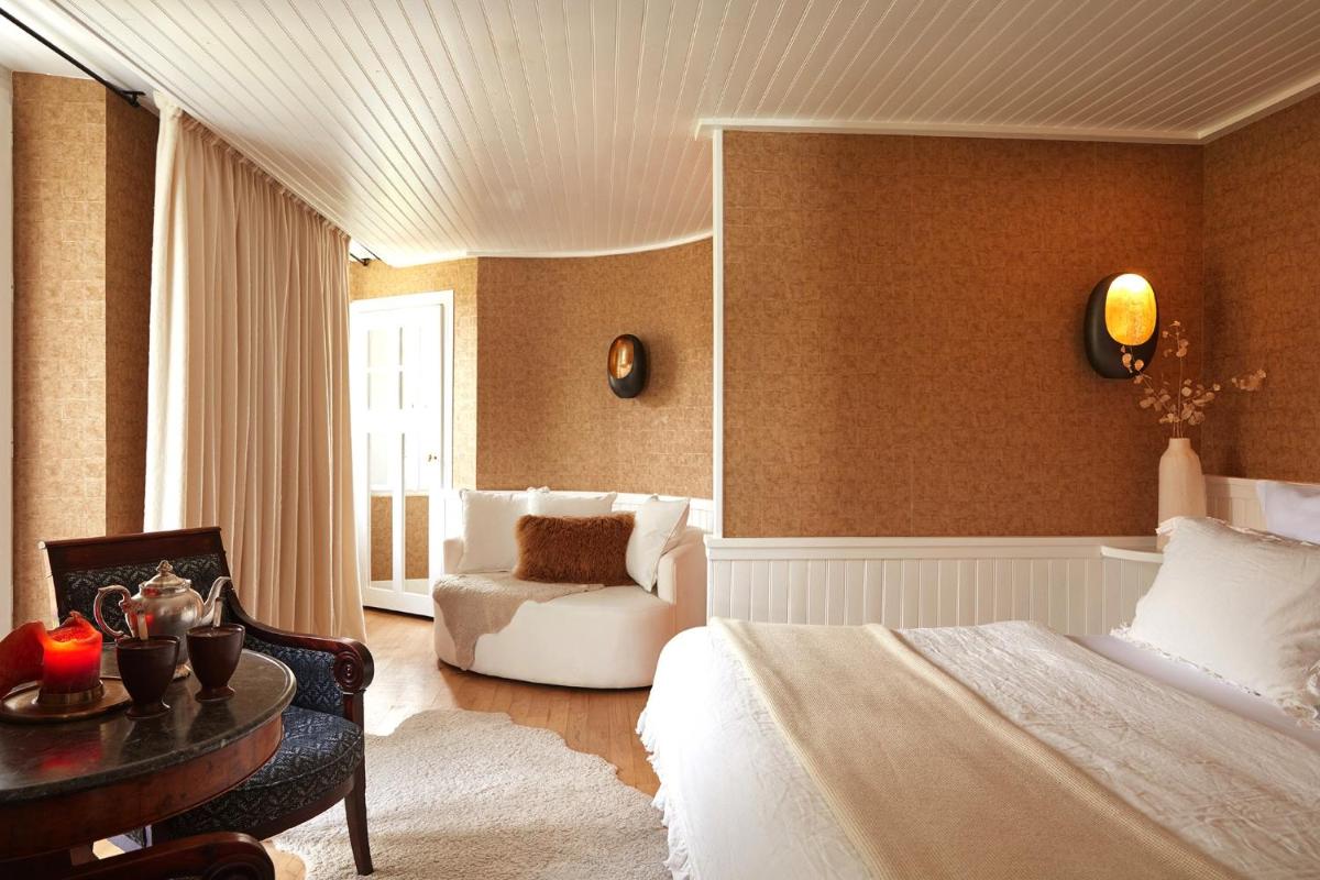 Un ou plusieurs lits dans un hébergement de l'établissement Grand Hotel Soleil d'Or