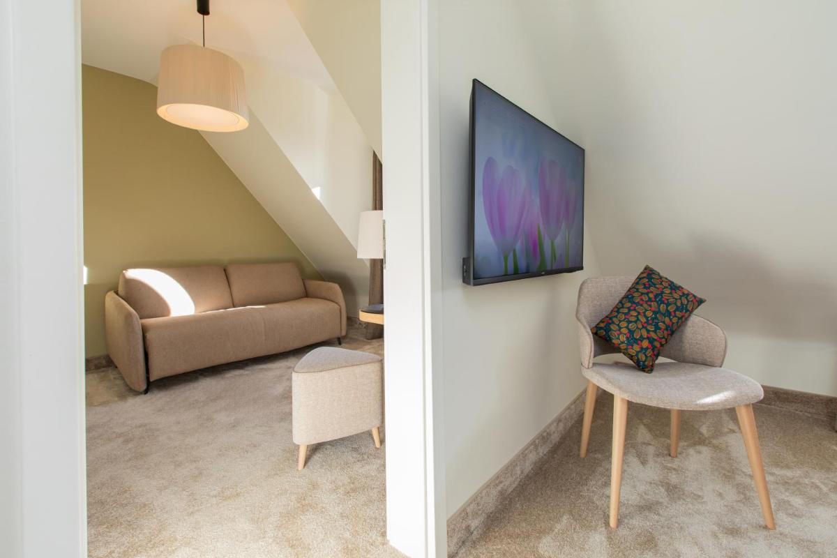 Coin salon dans l'établissement Hôtel Terra Vinum