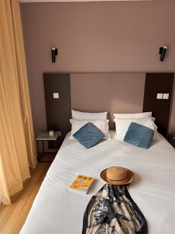 Un ou plusieurs lits dans un hébergement de l'établissement Résidence-Aïga Resort thermal & spa