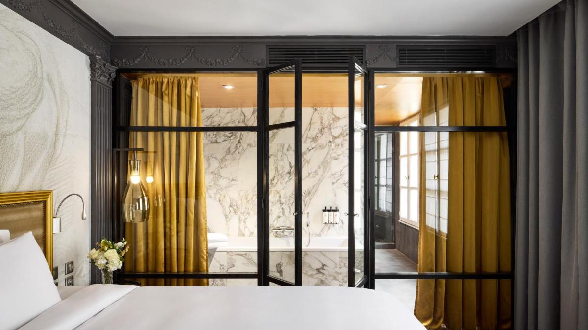 Un ou plusieurs lits dans un hébergement de l'établissement Sofitel Paris Le Faubourg