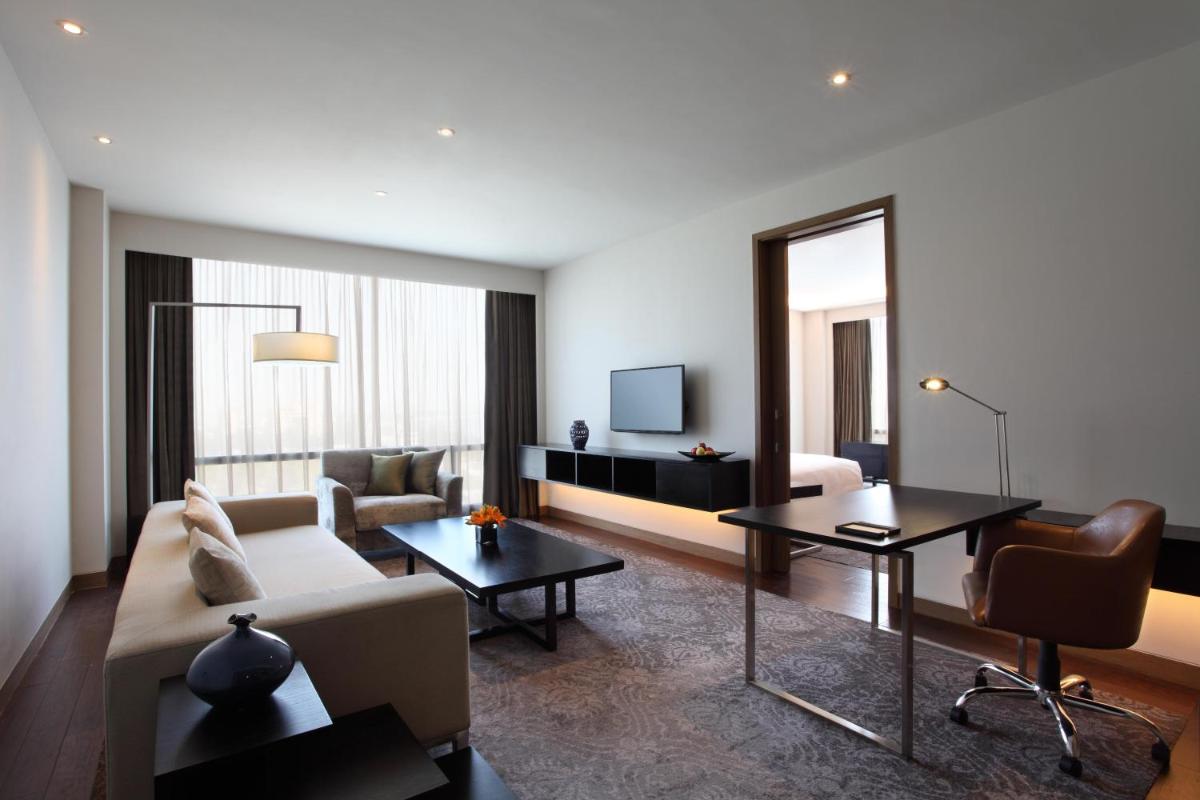 a living room with a couch and a table at Hyatt Regency Ahmedabad in Ahmedabad
