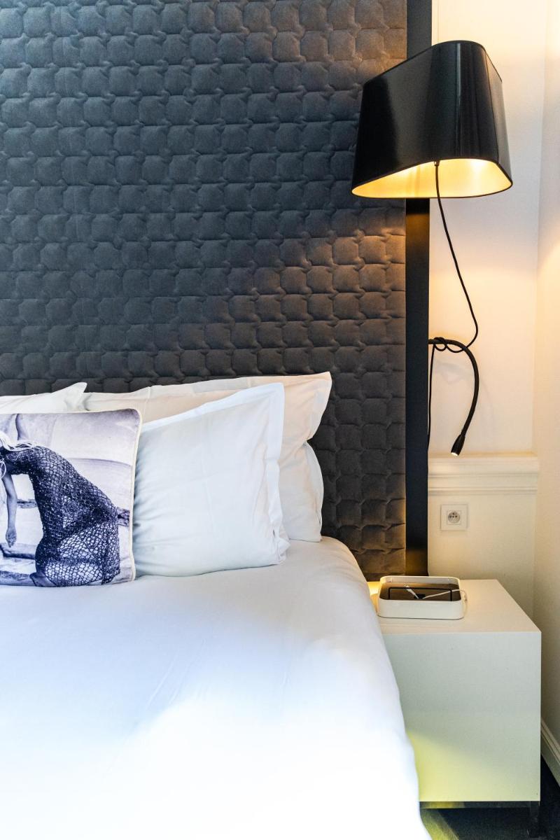 Un ou plusieurs lits dans un hébergement de l'établissement Vertigo Hotel, By Marriott, a Member of Design Hotels