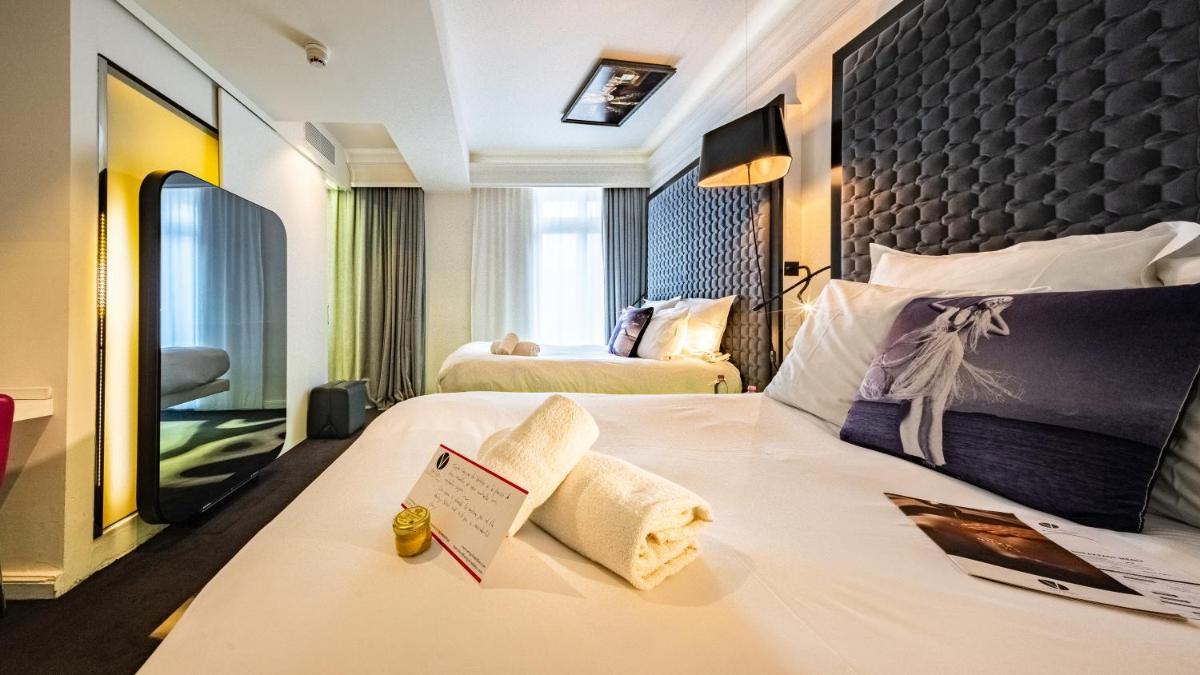 Un ou plusieurs lits dans un hébergement de l'établissement Vertigo Hotel, By Marriott, a Member of Design Hotels