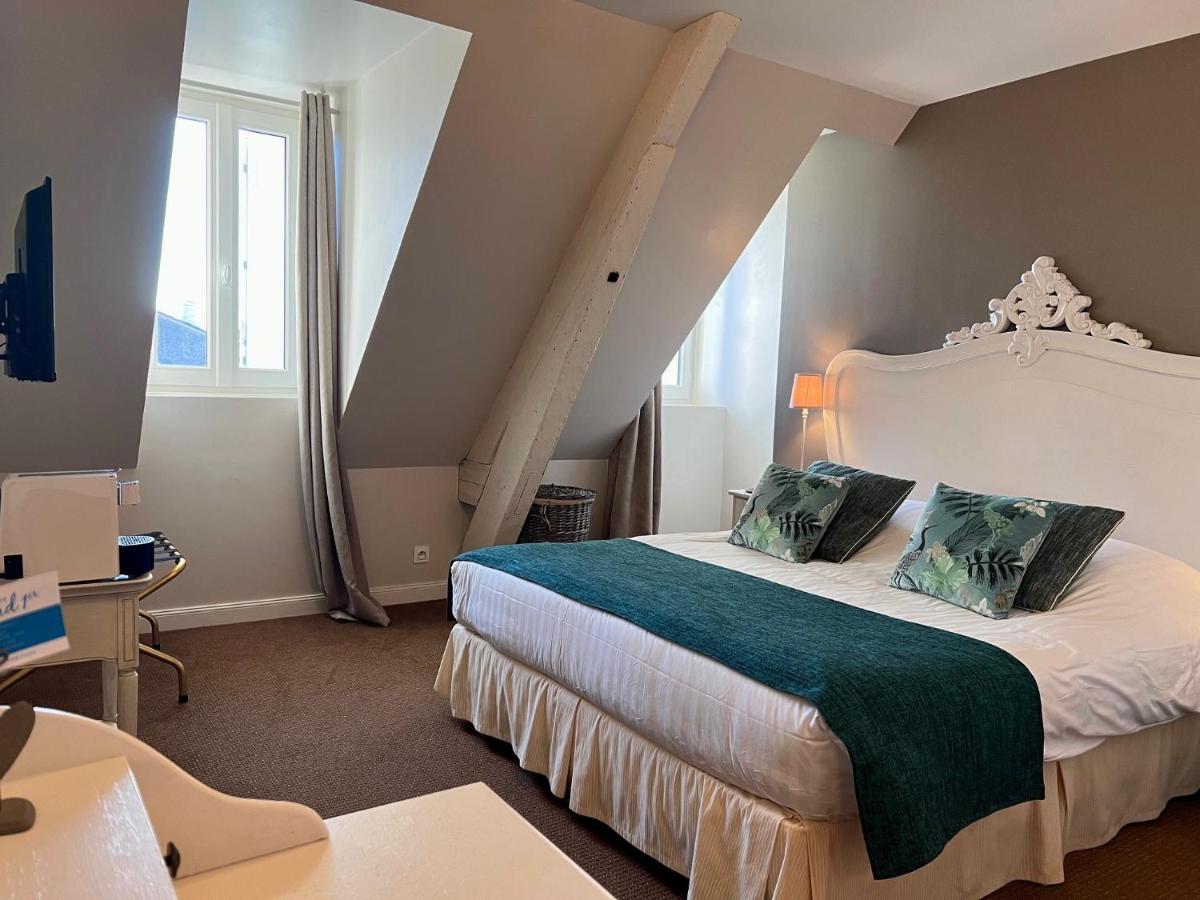 Un ou plusieurs lits dans un hébergement de l'établissement Château Hôtel Edward 1er