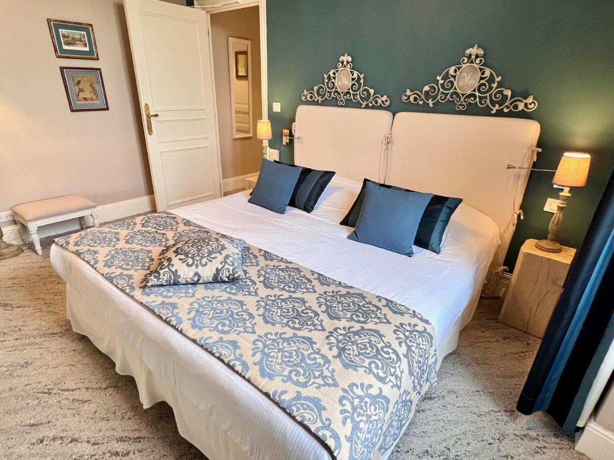 Un ou plusieurs lits dans un hébergement de l'établissement Château Hôtel Edward 1er