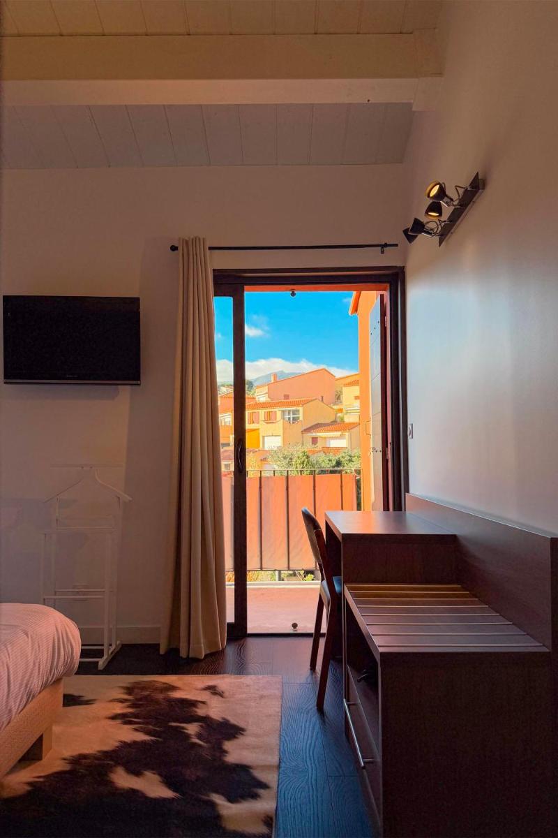 Un ou plusieurs lits dans un hébergement de l'établissement Hôtel & Spa Le Madeloc - Collioure Centre