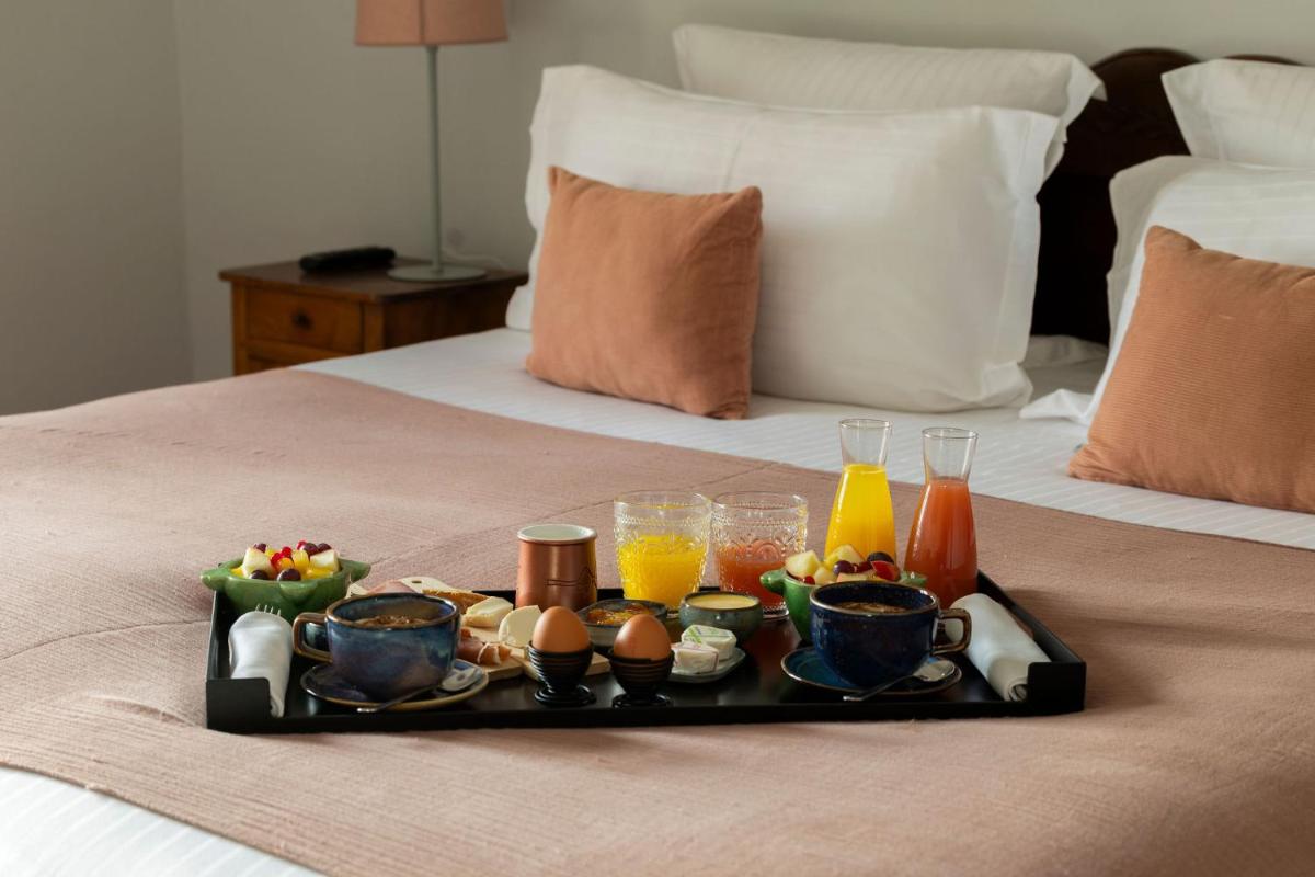 Un ou plusieurs lits dans un hébergement de l'établissement Hôtel - Restaurant & Spa La Magdeleine - Mathias Dandine