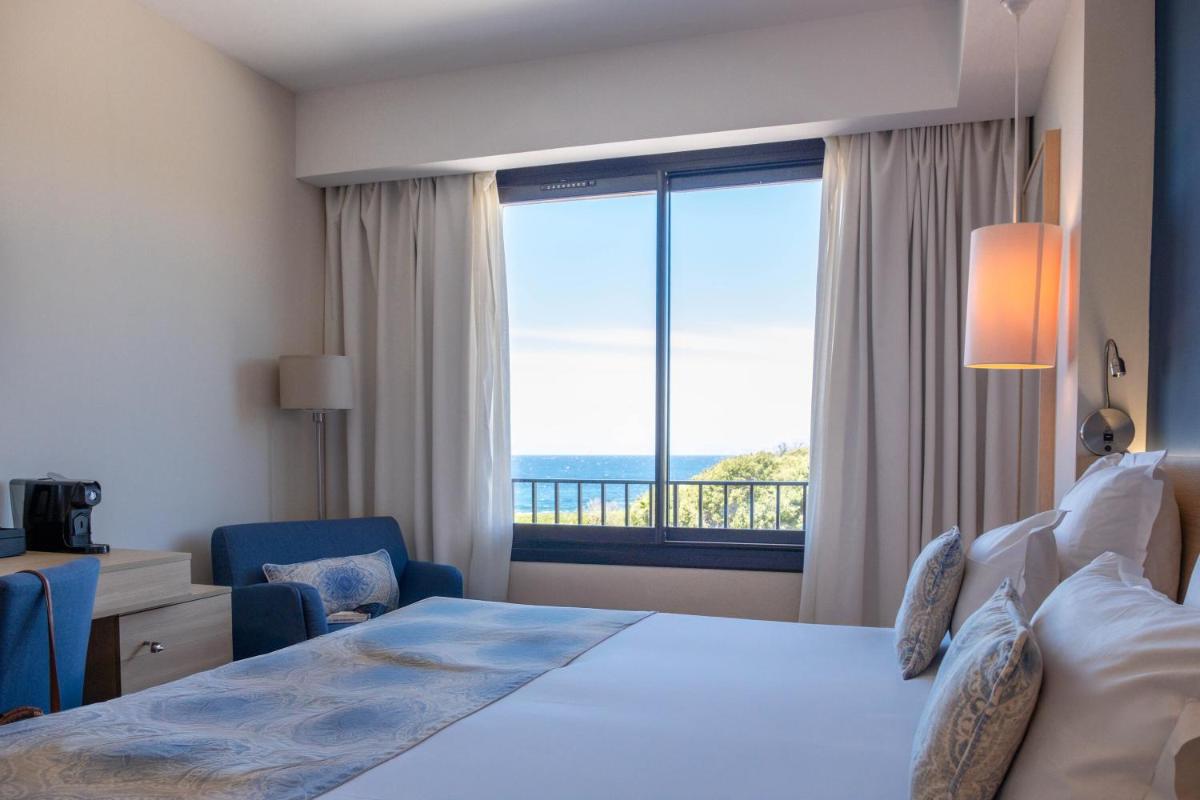 Un ou plusieurs lits dans un hébergement de l'établissement Hôtel Helios & SPA - Ile des Embiez
