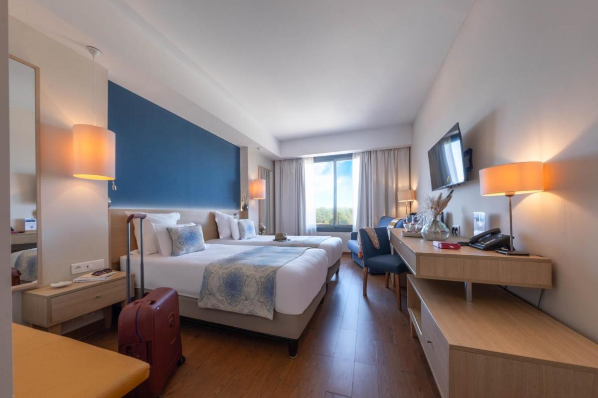 Un ou plusieurs lits dans un hébergement de l'établissement Hôtel Helios & SPA - Ile des Embiez