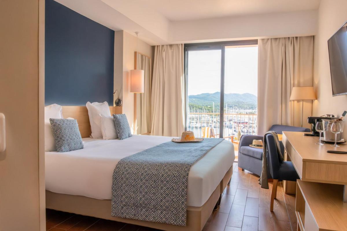 Un ou plusieurs lits dans un hébergement de l'établissement Hôtel Helios & SPA - Ile des Embiez