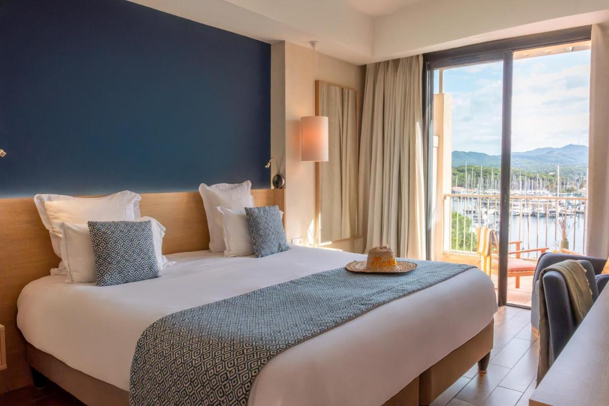 Un ou plusieurs lits dans un hébergement de l'établissement Hôtel Helios & SPA - Ile des Embiez