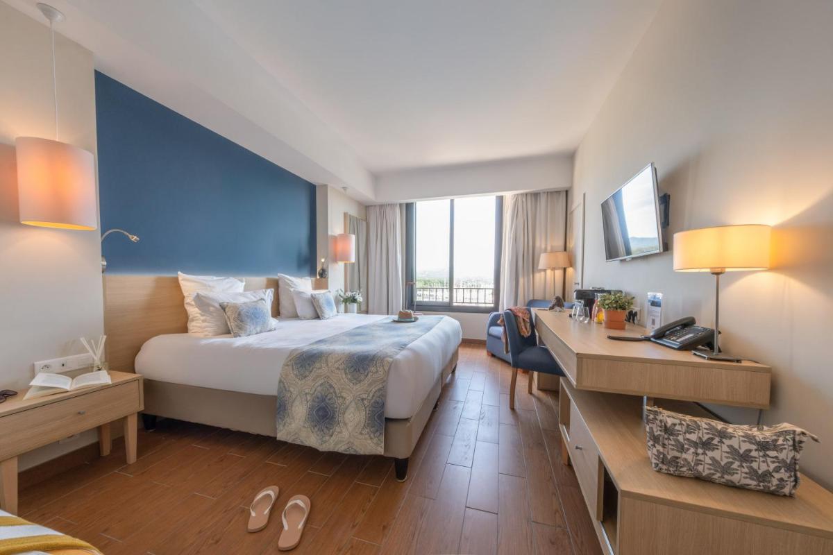 Un ou plusieurs lits dans un hébergement de l'établissement Hôtel Helios & SPA - Ile des Embiez
