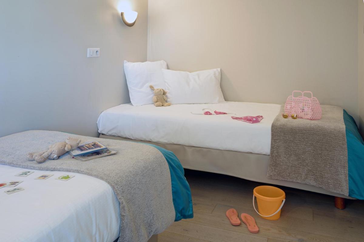 Un ou plusieurs lits dans un hébergement de l'établissement Hôtel de la Baie - Thalassothérapie PREVITHAL