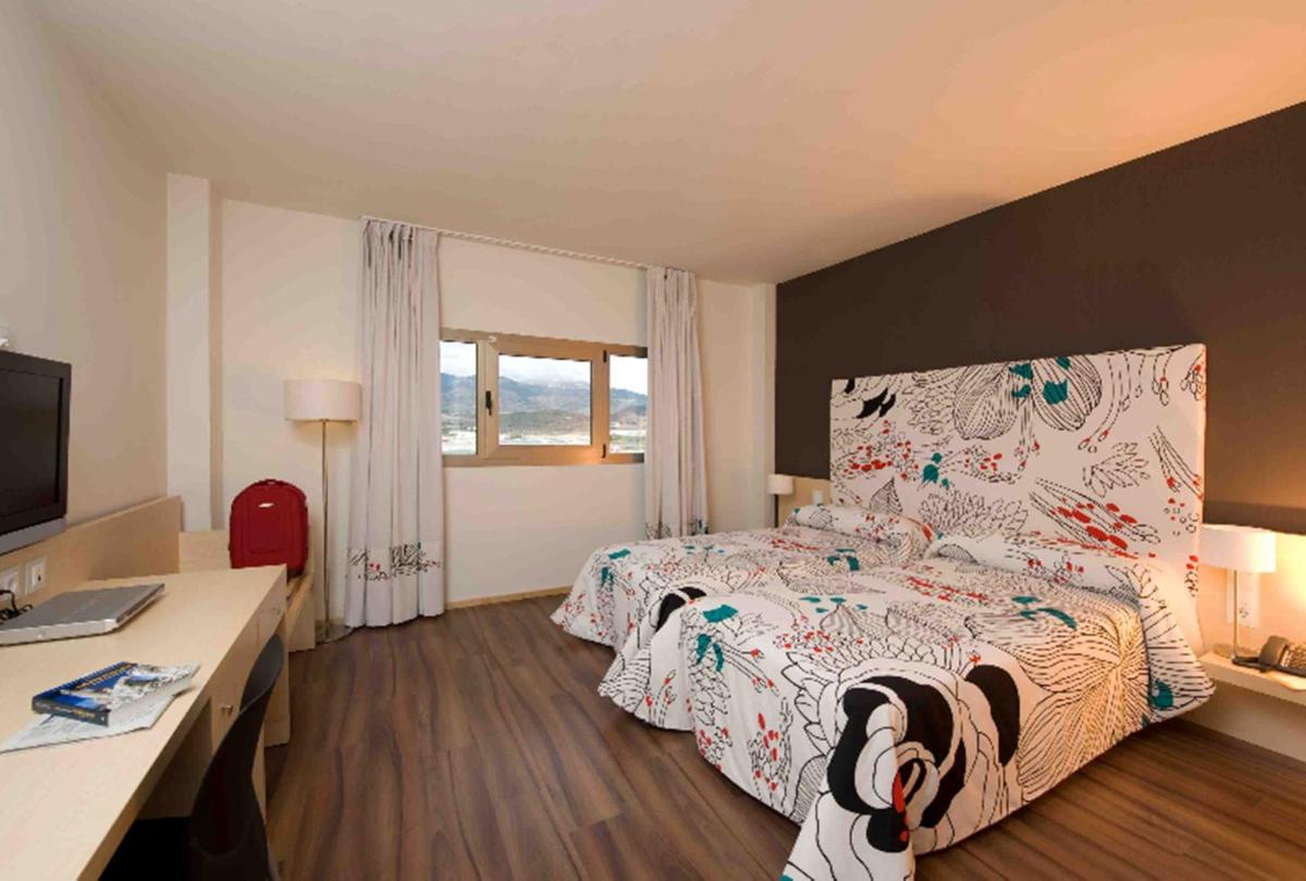 Cama o camas de una habitación en Executive Sport