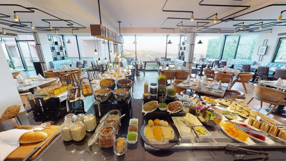 a buffet line with many different types of food at Radisson Hotel Shimla in Shimla