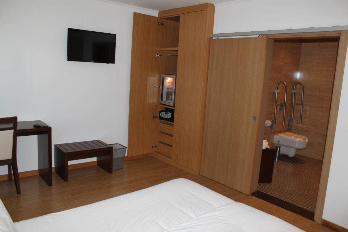 Uma cama ou camas num quarto em Hotel O Gato & Spa