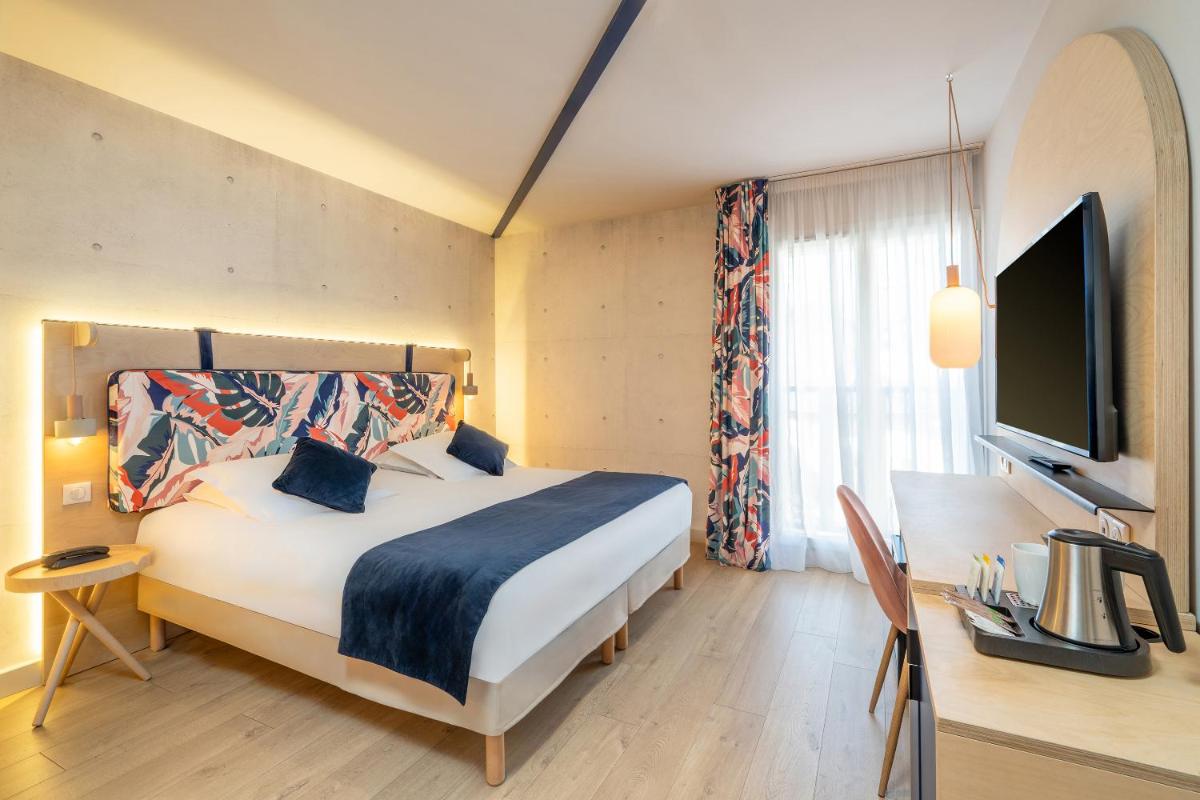 Un ou plusieurs lits dans un hébergement de l'établissement Urban Hotel & Spa Aix-les-Bains - BW Signature Collection