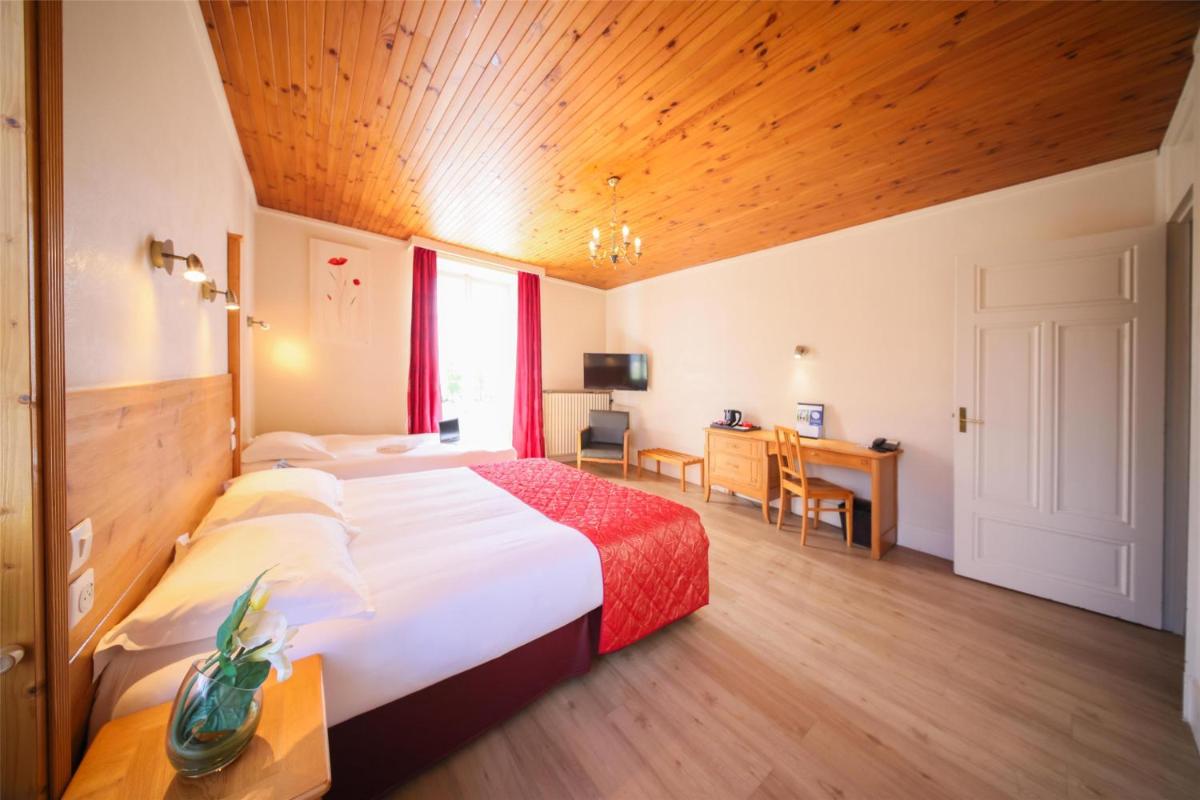 Un ou plusieurs lits dans un hébergement de l'établissement Best Western Grand Hotel de Paris & Spa